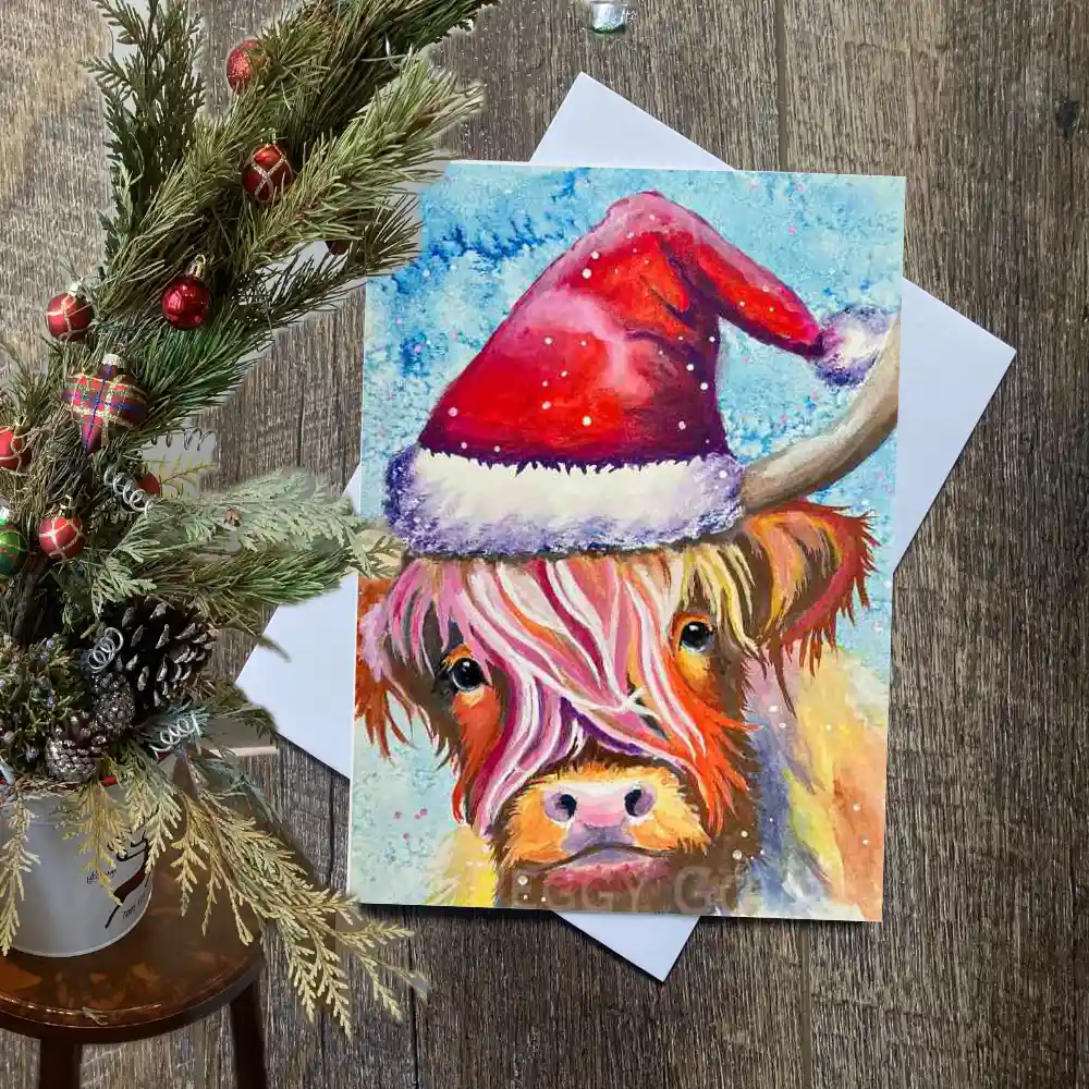 Colourful and whimsical Highland cow Christmas card, closeup